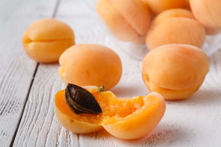 Apricots on wooden tableの写真素材