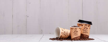 coffee cups on wooden table for site headerの写真素材
