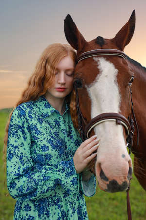 Portrait of a horse and woman, outdoorの写真素材