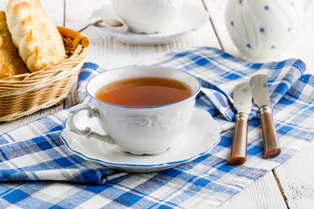cup of tea in a beautiful cup for breakfast at homeの写真素材