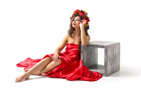 Spring Woman. Beauty Summer model girl with colorful flowers wreath and colorful hair.の写真素材