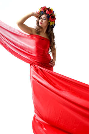 Woman bright summer look beautiful clothes. Flowers wreath on head.の写真素材