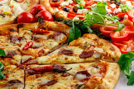 Piece of delicious vegetables and cheese pizzaの写真素材