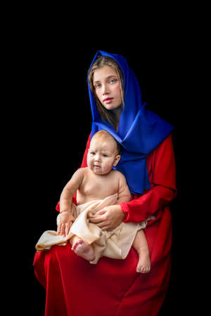 Mother with baby, motherhood concept. in the image of the madonnaの写真素材