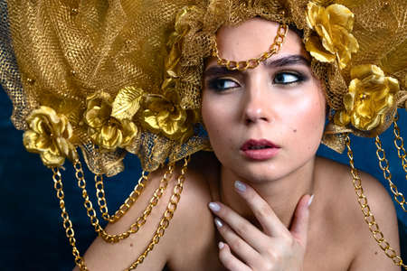 Young fashion model posing in studioの写真素材