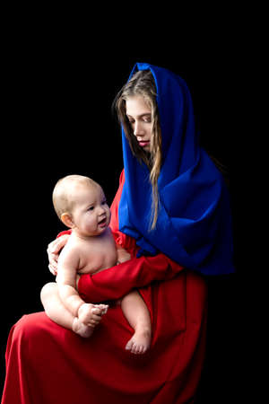 Mother with baby, motherhood concept. in the image of the madonnaの写真素材