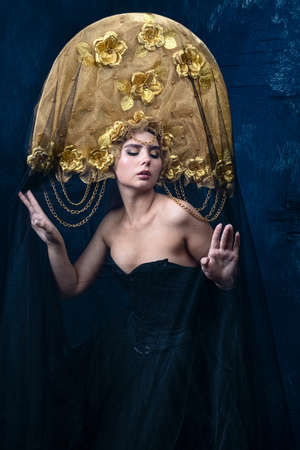 Portrait of a beautiful fashion model face with fancy hatの写真素材
