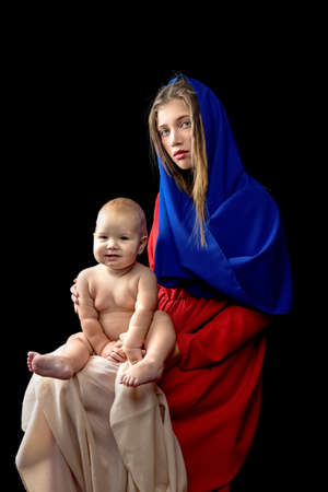 Portrait of loving mother and her baby on hand, mother's day conceptの写真素材
