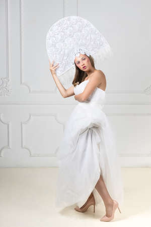 Portrait of beautiful blonde woman in fancy hatの写真素材