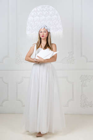 Amazed woman at russian traditional cap hat kokoshnikの写真素材