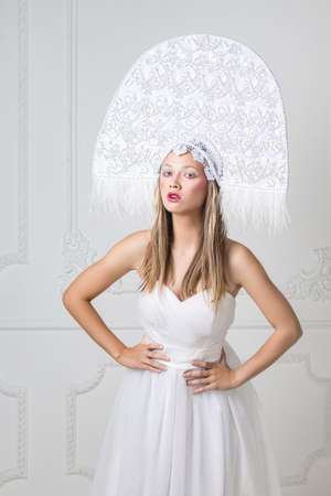 Amazed woman at russian traditional cap hat kokoshnikの写真素材