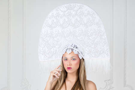 Portrait of beautiful blonde woman in fancy hatの写真素材