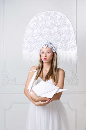 Portrait of beautiful blonde woman in fancy hatの写真素材