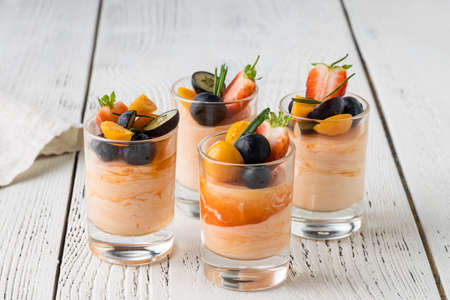 Catering for party. Close up of sandwiches, appetizers and fruitの写真素材