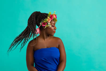 Young African model with a beautiful makeup in studio in vivid backgroundの写真素材