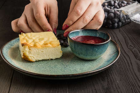 sweet curd pudding with berries on a plateの写真素材