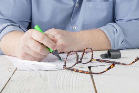 Coronavirus outbreak. Man working from home, wearing surgical disposable gloves for protection against virus and bacteriaの写真素材