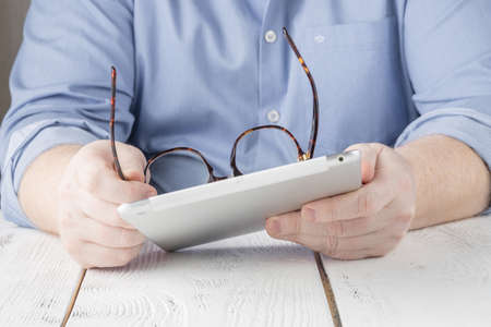 Business man working on digital tablet in the office or homeの写真素材