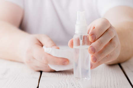 hands using bottle of hand sanitizer, hand desinfectant. preventing virus infection during epidemic or pandemicの写真素材