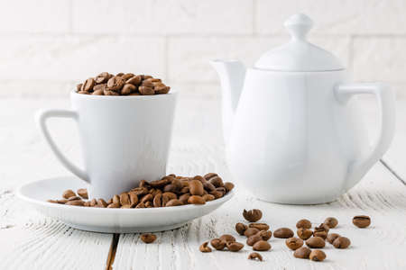 coffee beans from the white ceramic cupの写真素材