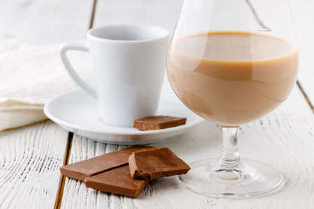 coffee in white ceramic cup and chocoの写真素材