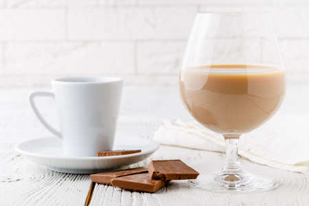 coffee in white ceramic cup and chocoの写真素材