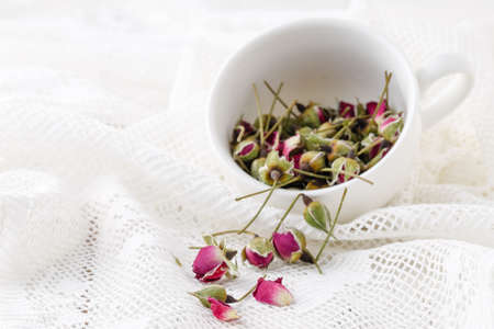 Floral tea with rose hips in bowlの写真素材