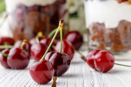 Delicius trifle with cherry and cream for breakfastの写真素材