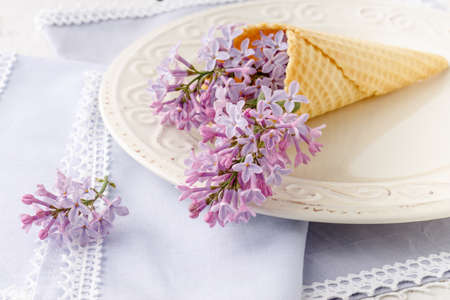 Romantic gift lilac flowers on tableの写真素材