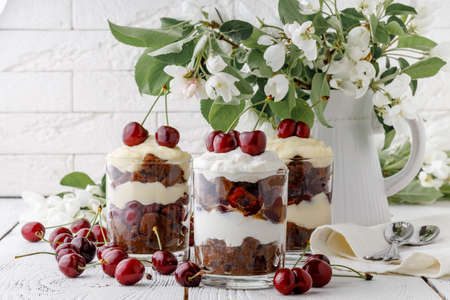 Delicius trifle with cherry and cream for breakfastの写真素材