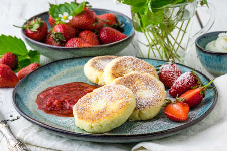 Cheesecakes with berry and sour cream. Yummy dessertの写真素材
