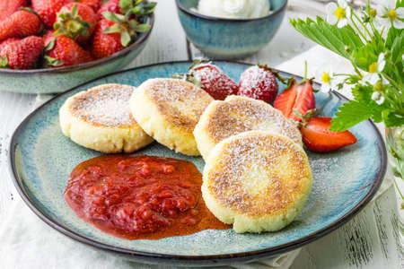 Cheesecakes with berry and sour cream. Yummy dessertの写真素材