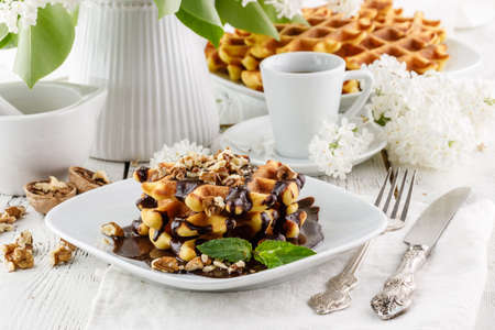 Fresh homemade belgian waffers for breakfastの写真素材