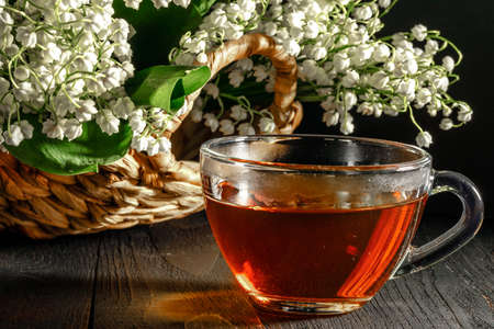 Lily of the valley on dark wooden tableの写真素材