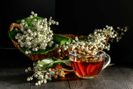 Lily of the valley on dark wooden tableの写真素材