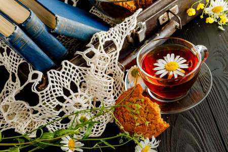 retro style freakfast with oat cookies and booksの写真素材