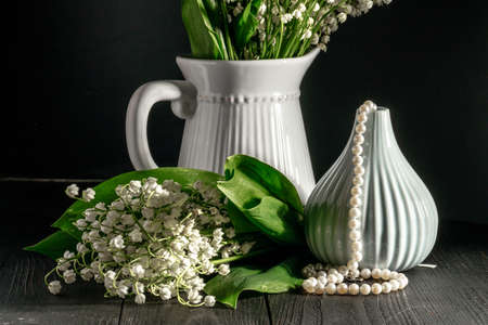 Lily of the valley on dark wooden tableの写真素材