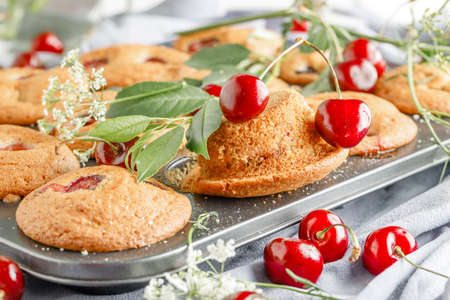 homemade vegan muffins with fresh cherriesの写真素材