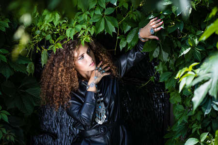 Beautiful modern girl near the brickwall. Youth style. Fashion shot.の写真素材
