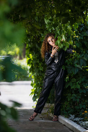 Beautiful modern girl near the brickwall. Youth style. Fashion shot.の素材 [FY310157905926]