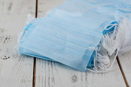 Many stacked medical blue masksの写真素材