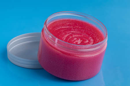 Sugar body scrub on blue backgroundの写真素材