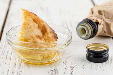 Close up olive oil bottle on tableの写真素材