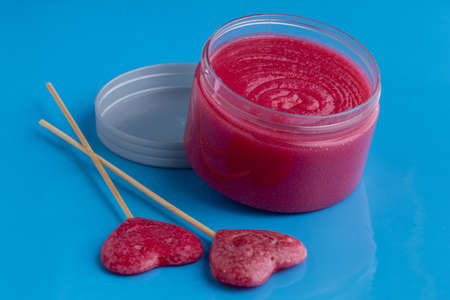 Sugar body scrub on blue backgroundの写真素材