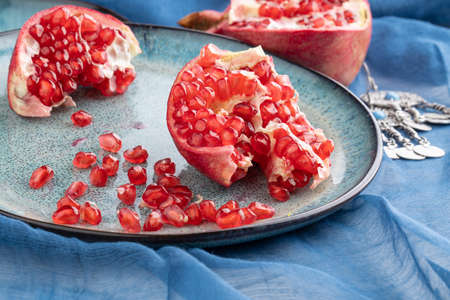 Beautiful red pomegranate fruit composition on a plate background. Azerbaijanの写真素材