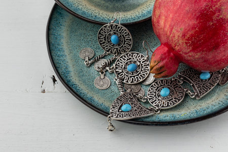 Beautiful red pomegranate fruit composition on a plate background. Azerbaijanの写真素材