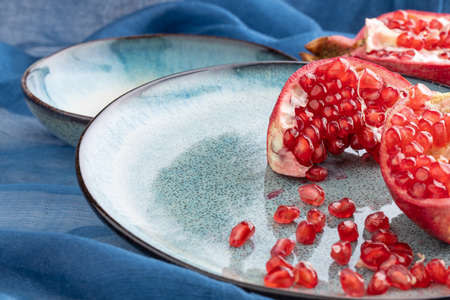 Beautiful red pomegranate fruit composition on a plate background. Azerbaijanの写真素材