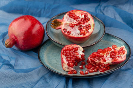 Beautiful red pomegranate fruit composition on a plate background. Azerbaijanの写真素材