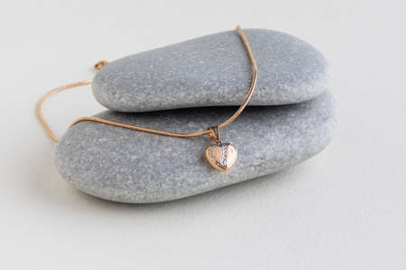 White pearls on a gray stoneの写真素材