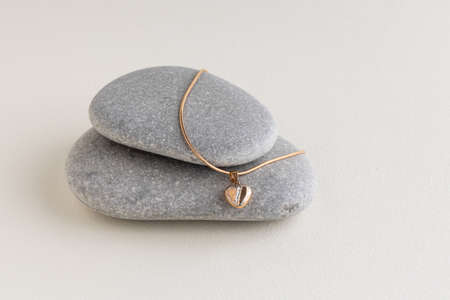 White pearls on a gray stoneの写真素材